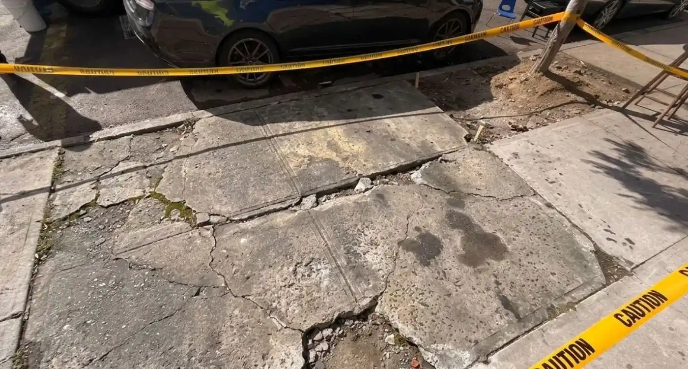 broken and uneven sidewalk slabs before replacement