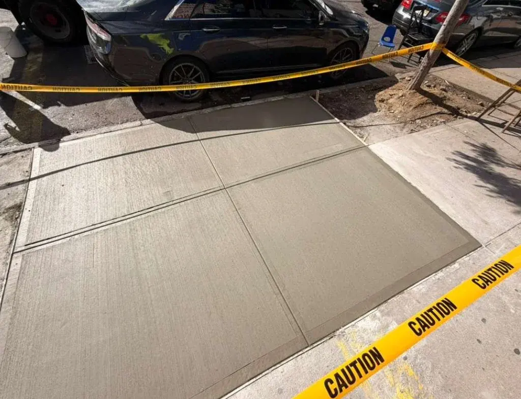 new concrete sidewalk slabs after violation repair